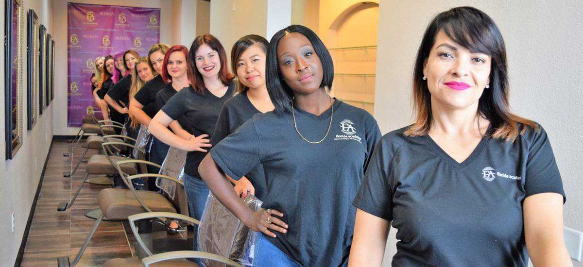 Cosmo students standing by client chairs