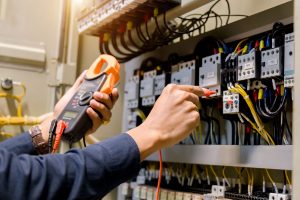 Electrician working with wiring system